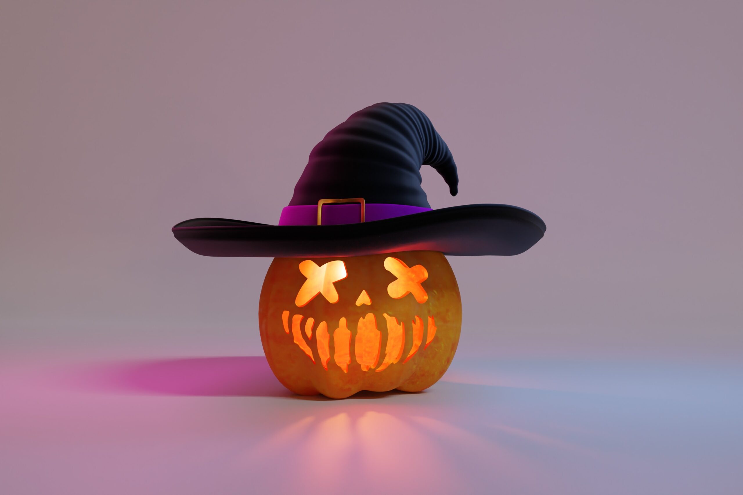 carved pumpkin with witch hat on