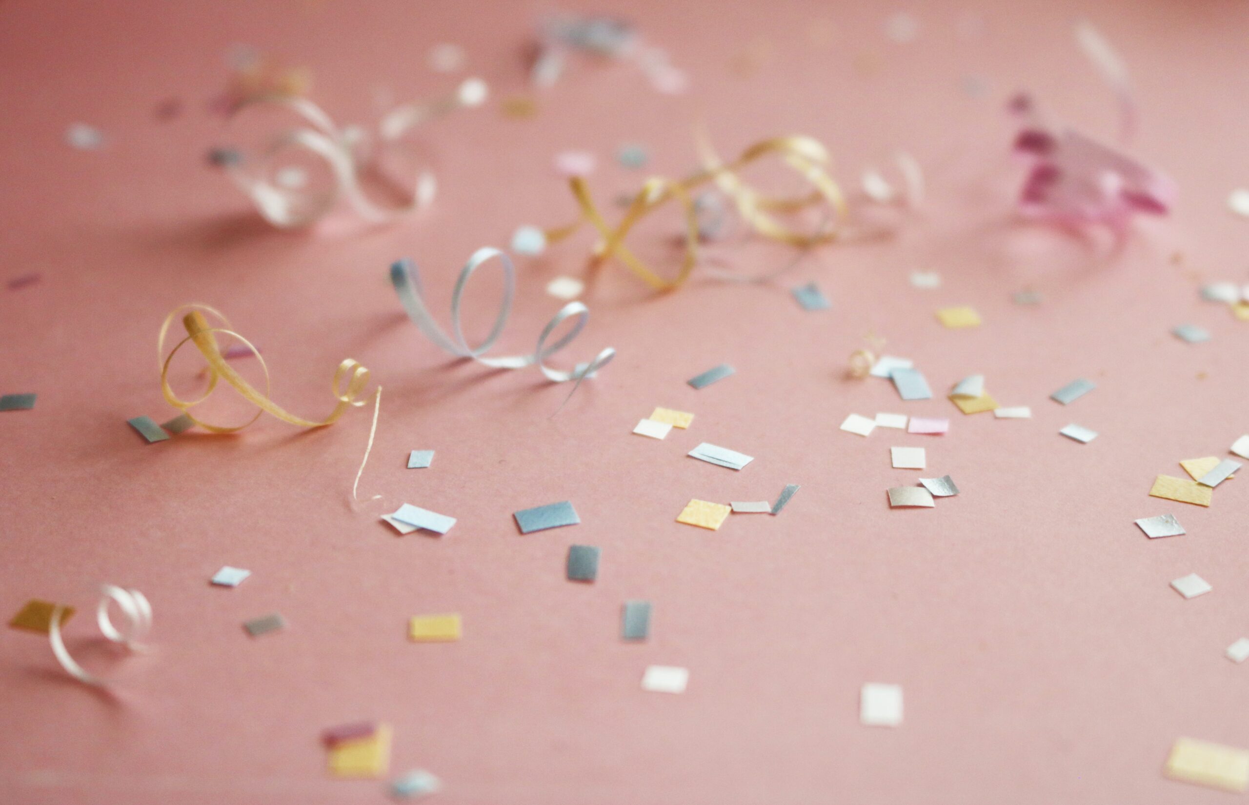 colored confetti on a pink table